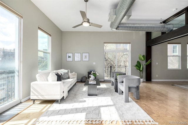 2501 15th St Unit 2C, Denver, CO 80211 - living room featuring healthy amount of natural light and a ceiling fan