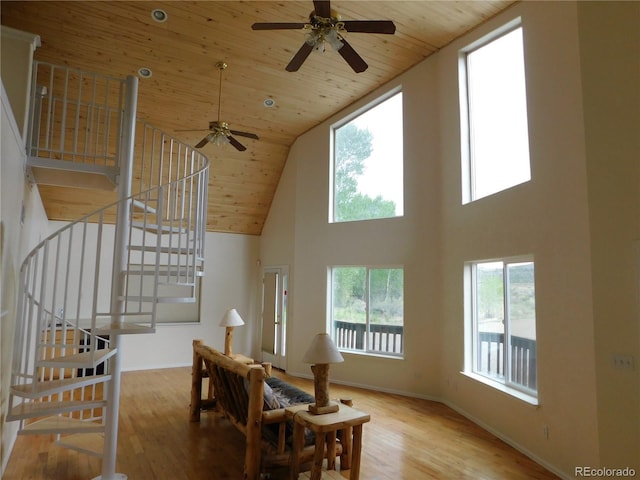 11003 US Highway 160, Del Norte, CO 81132 - stairway with wooden ceiling, a towering ceiling, ceiling fan, wood finished floors, and baseboards