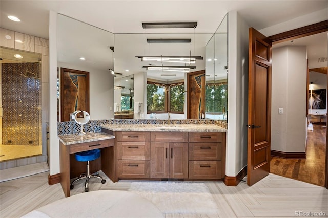 bathroom with vanity and hardwood / wood-style flooring