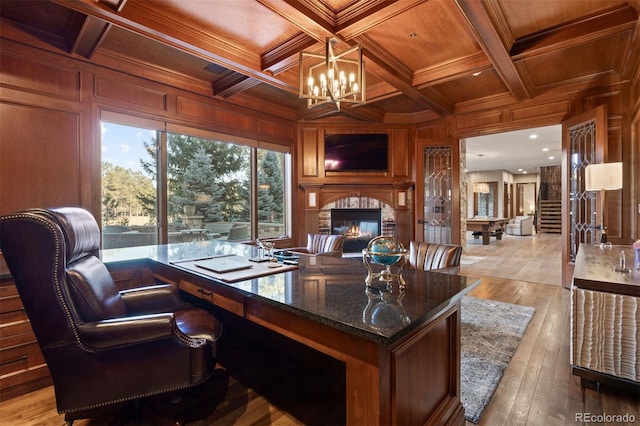 office with ornamental molding, wooden ceiling, coffered ceiling, and wood walls