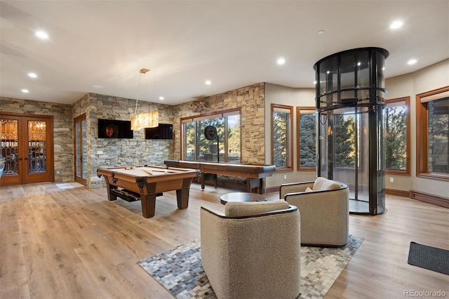 game room with light hardwood / wood-style flooring, pool table, and french doors