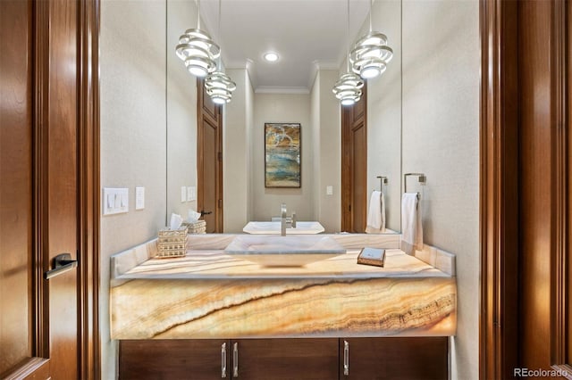 bathroom featuring vanity and crown molding