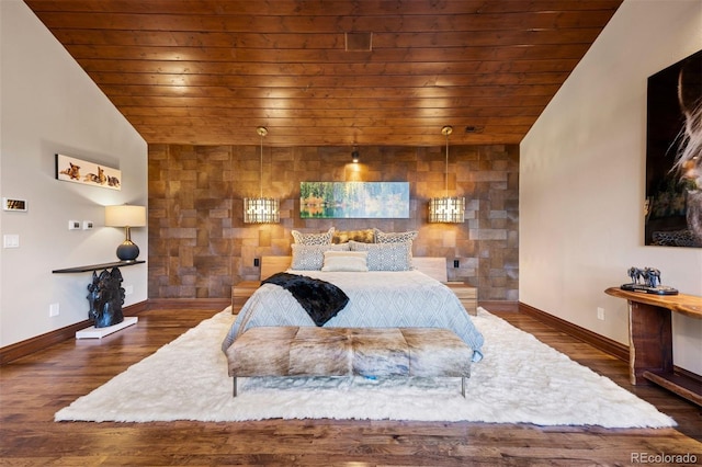 bedroom featuring wood ceiling, wood finished floors, baseboards, and lofted ceiling