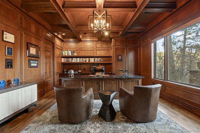 bar with wooden ceiling, dark wood finished floors, a notable chandelier, and a decorative wall