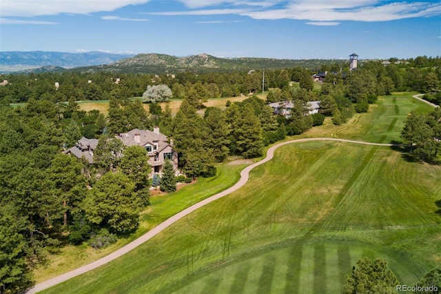 drone / aerial view with a mountain view and golf course view