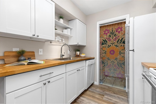 1820 Newland Ct Unit 310, Lakewood, CO 80214 - kitchen with wood counters, a sink, and white appliances