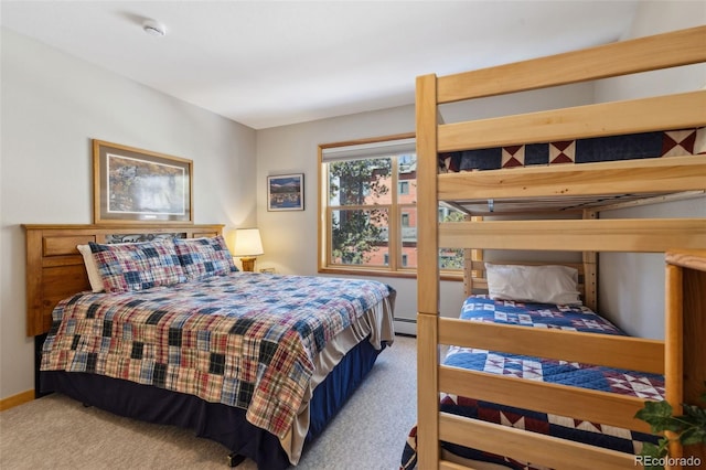 carpeted bedroom with baseboards and a baseboard radiator