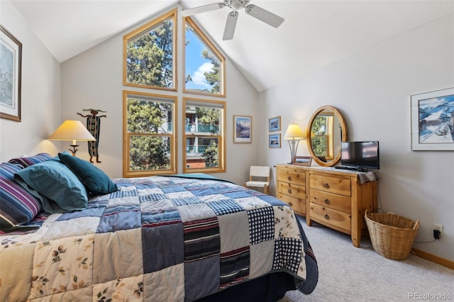 bedroom with carpet floors, lofted ceiling, and a ceiling fan