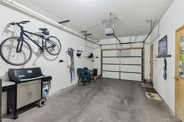 garage featuring a garage door opener