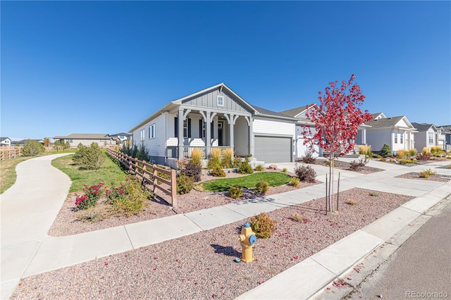 view of front of house with a garage and a porch