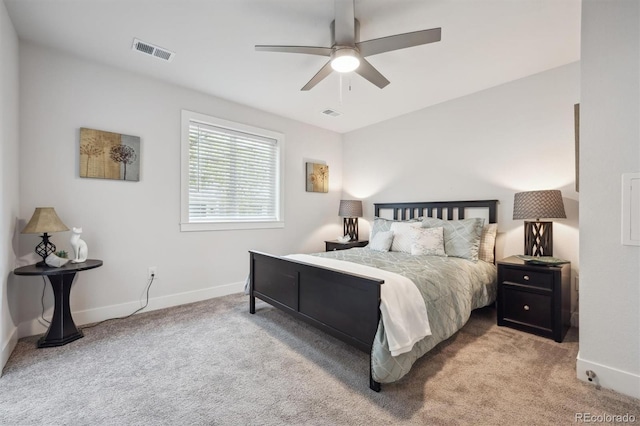 bedroom with baseboards, visible vents, carpet flooring, and a ceiling fan