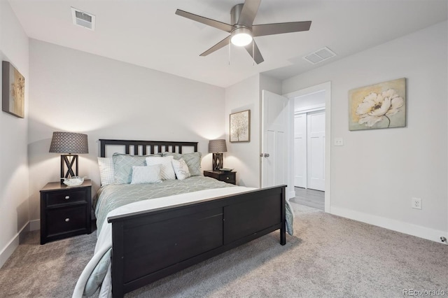 carpeted bedroom featuring a ceiling fan, baseboards, and visible vents