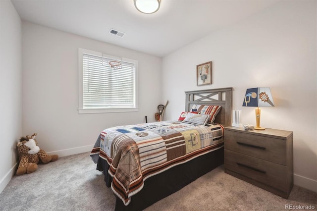 bedroom with baseboards, visible vents, and carpet floors