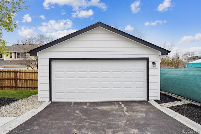 detached garage with fence