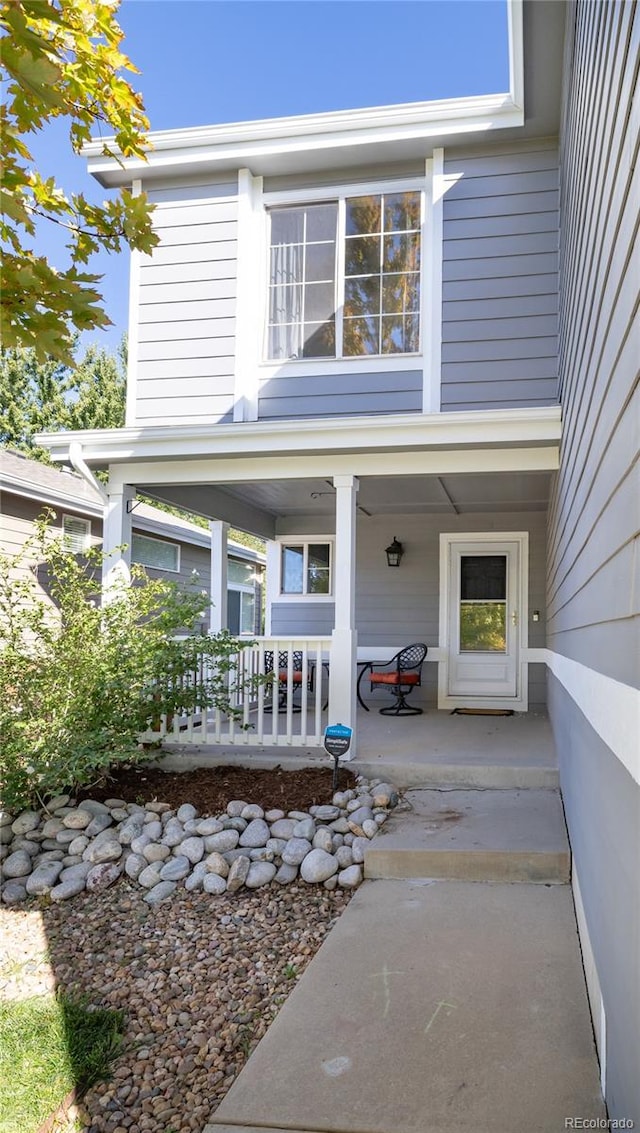 doorway to property with a porch