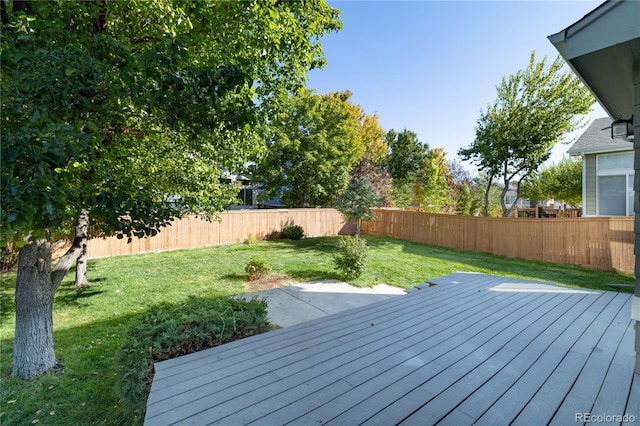 wooden deck with a lawn