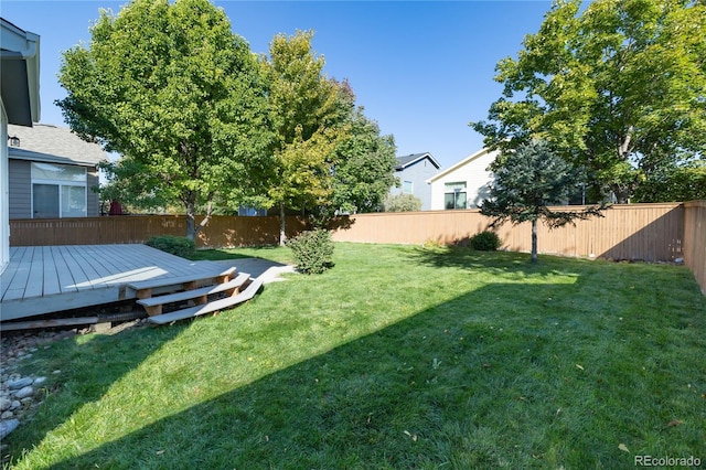 view of yard with a wooden deck