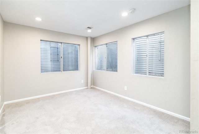 empty room featuring light colored carpet