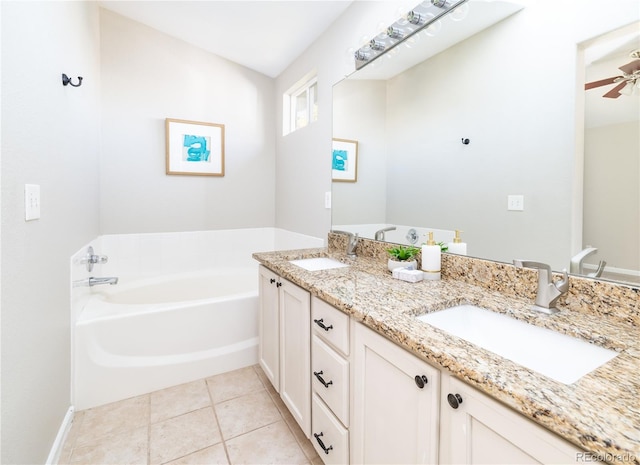 bathroom featuring a bathtub, tile patterned floors, ceiling fan, and vanity