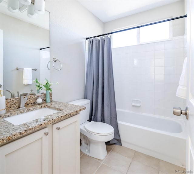 full bathroom with vanity, tile patterned floors, toilet, and shower / bath combo