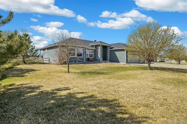 56330 E 37th Ct, Strasburg, CO 80136 - ranch-style home featuring a front yard