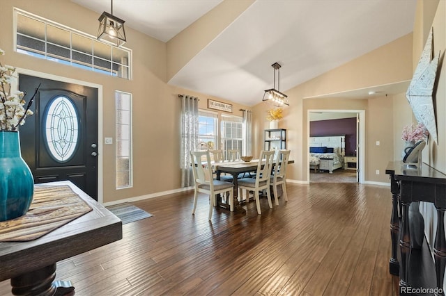 56330 E 37th Ct, Strasburg, CO 80136 - entrance foyer featuring wood-type flooring, baseboards, and lofted ceiling