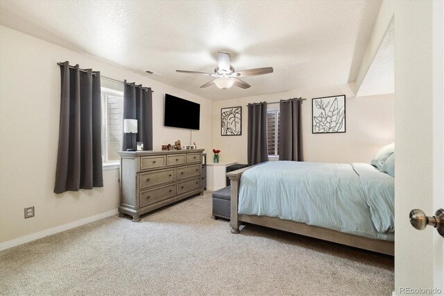 56330 E 37th Ct, Strasburg, CO 80136 - bedroom featuring baseboards, light colored carpet, and ceiling fan