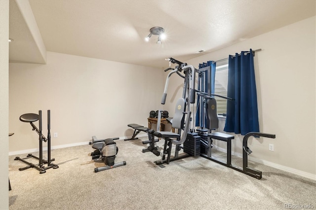 56330 E 37th Ct, Strasburg, CO 80136 - workout room featuring carpet floors and baseboards