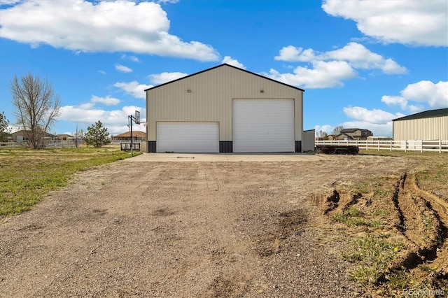 56330 E 37th Ct, Strasburg, CO 80136 - detached garage with fence