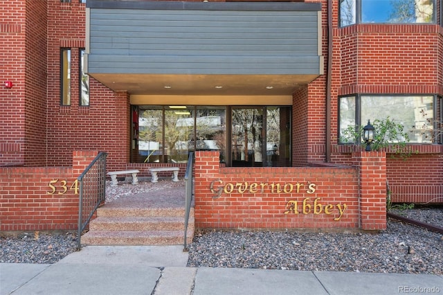 entrance to property with brick siding