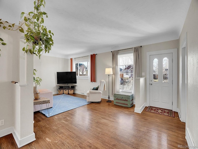 foyer entrance with hardwood / wood-style floors