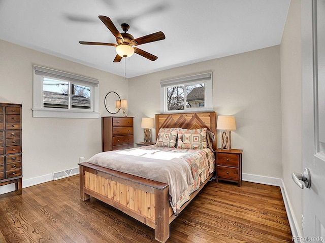 bedroom with dark wood-type flooring and ceiling fan