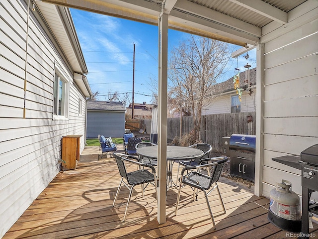 wooden deck with a grill