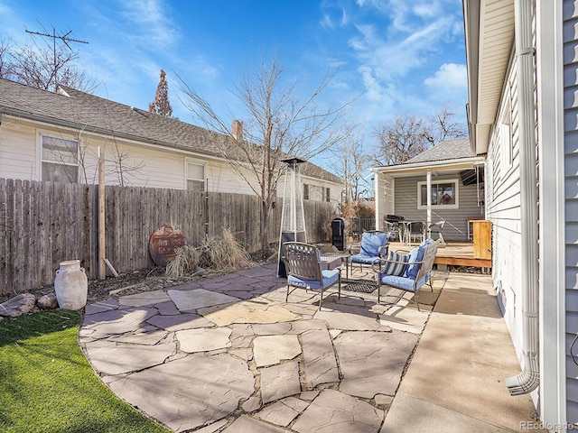 view of patio featuring an outdoor living space and a wooden deck