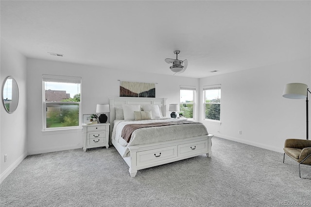 carpeted bedroom featuring baseboards