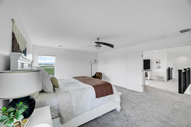 carpeted bedroom featuring ceiling fan