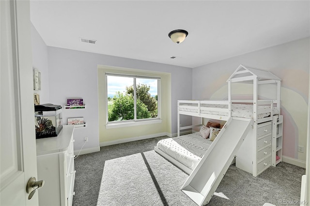 carpeted bedroom with baseboards