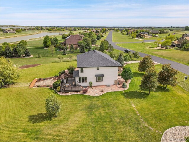 aerial view of property and surrounding area with a large body of water