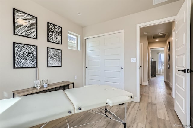 laundry room with light wood-type flooring