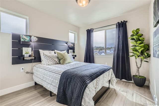 bedroom with hardwood / wood-style flooring