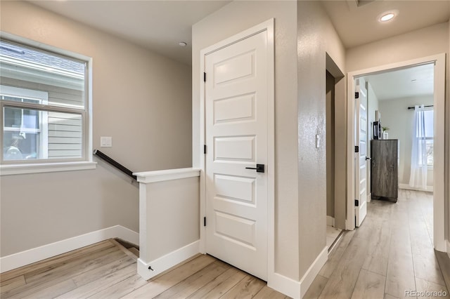 128 E Douglas St, Superior, CO 80027 - corridor with light wood-style floors, an upstairs landing, baseboards, and recessed lighting