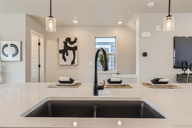 kitchen featuring sink and decorative light fixtures