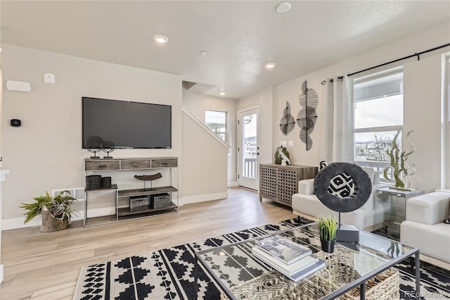 128 E Douglas St, Superior, CO 80027 - living area with healthy amount of natural light, wood finished floors, baseboards, and recessed lighting