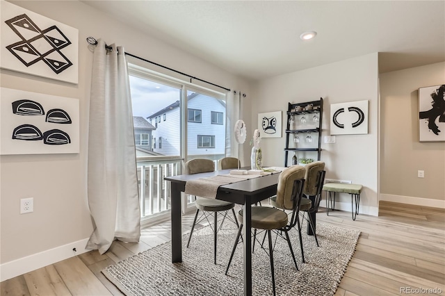 dining space featuring light hardwood / wood-style floors