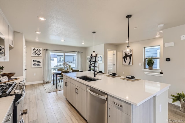 128 E Douglas St, Superior, CO 80027 - kitchen featuring appliances with stainless steel finishes, a sink, baseboards, light countertops, and recessed lighting