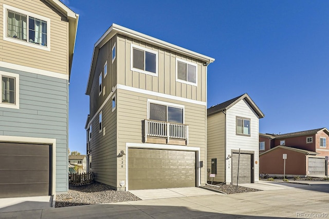 128 E Douglas St, Superior, CO 80027 - view of front of property with an attached garage, board and batten siding, and driveway