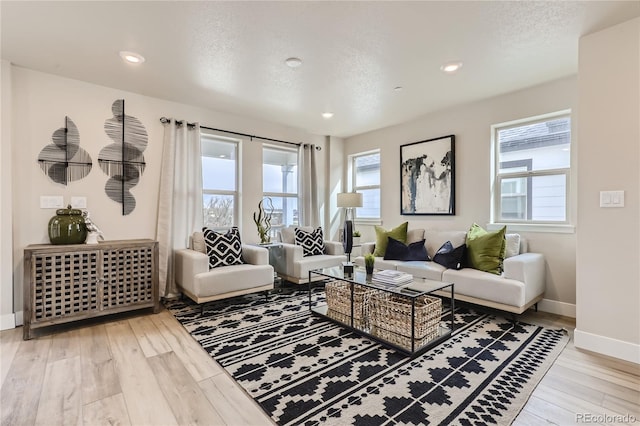 128 E Douglas St, Superior, CO 80027 - living room with wood finished floors, baseboards, and recessed lighting