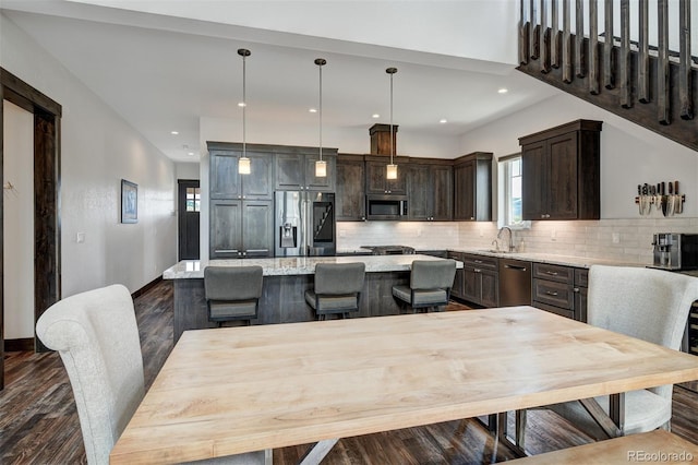 701 Saddle Ridge Cir, Granby, CO 80446 - dining area featuring healthy amount of natural light, dark wood-type flooring, recessed lighting, and baseboards