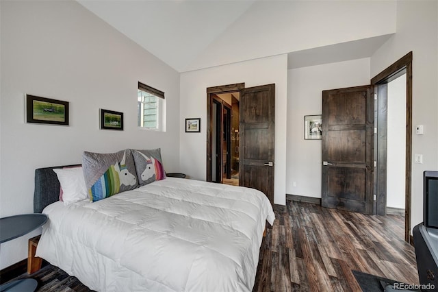 701 Saddle Ridge Cir, Granby, CO 80446 - bedroom featuring wood finished floors and vaulted ceiling