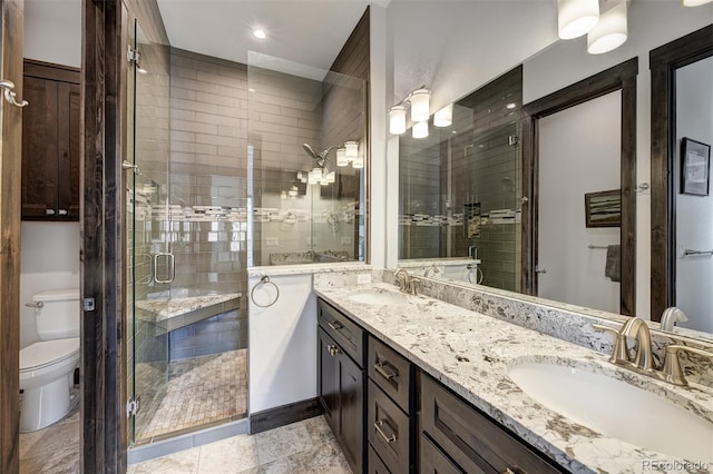 701 Saddle Ridge Cir, Granby, CO 80446 - bathroom with double vanity, a stall shower, toilet, and recessed lighting
